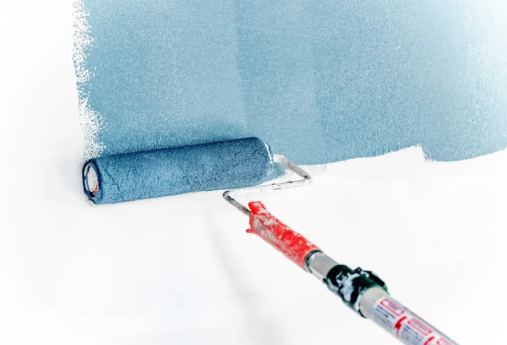 Painter applying a clean finish to an interior wall